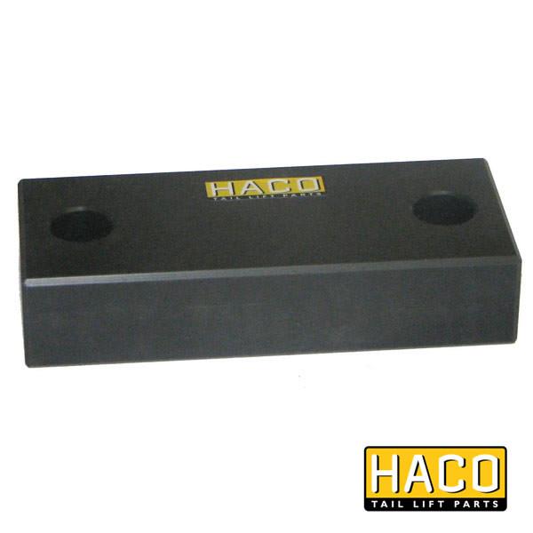 Stop rubber 118x50mm HACO, a black rectangular object with two holes, compatible with Dhollandia Tail Lifts, model M1404, suitable for commercial trailers.