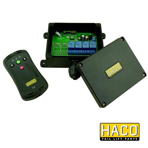 Universal Wireless Remote Control for Tail Lifts, featuring a black box with a green circuit board and a black remote control with up and down buttons.