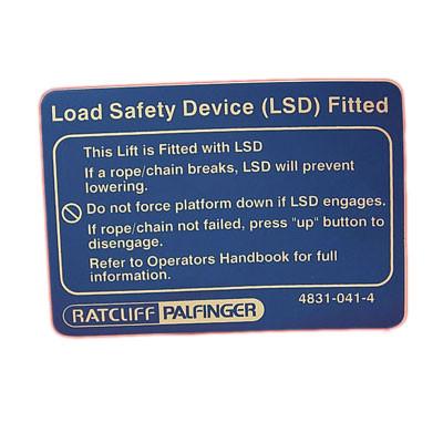 Load Safety Device Fitted Sign for Ratcliff Palfinger Tail Lifts, showing blue background with white text, suitable for commercial trailer safety applications.