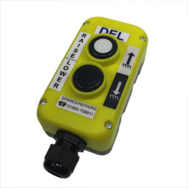 Mafelec 2 Button Control Station, a yellow electronic device with black buttons, designed for efficient control of Del Tail Lifts.