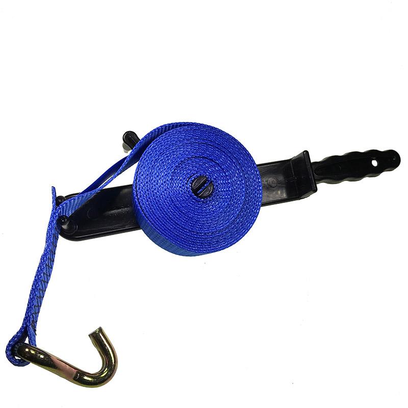 Strap Winder on a black hook, designed for efficiently rolling up heavy-duty ratchet straps, ideal for commercial trailer use.