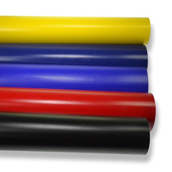 Curtain Material rolls made of 900gsm Panama PVC, suitable for trailer curtainsides, shown in a group highlighting the product's durability and variety.